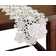 The Holiday Aisle Shimmer Snowflake Embroidered Cutwork Table Runner